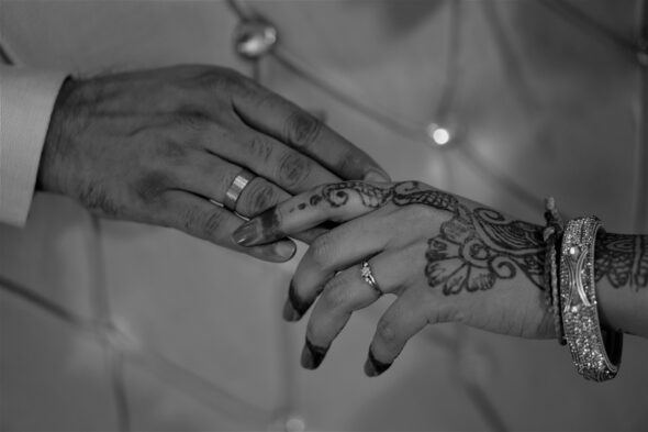 A happy couple celebrating their successful marriage arranged through a marriage bureau.